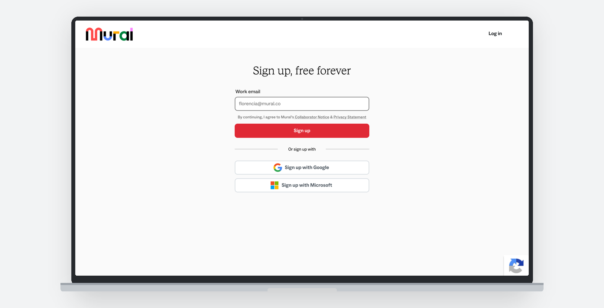 The shipped signup screen on a laptop: one work email field, the
              terms line set small above the Sign up button, and Google and
              Microsoft below it.